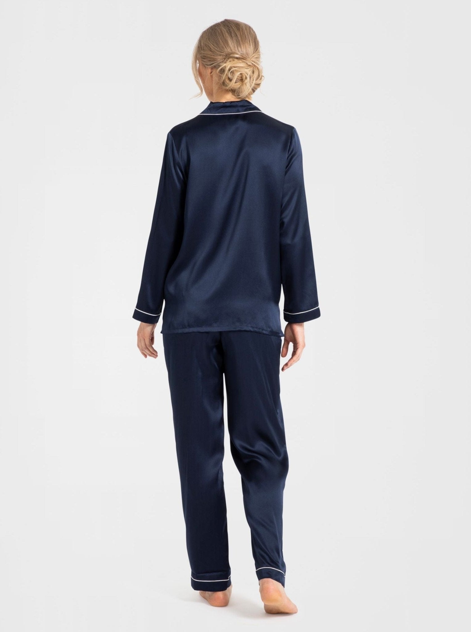 Back view of Park Avenue navy silk pyjamas highlighting contrast piping and relaxed fit.