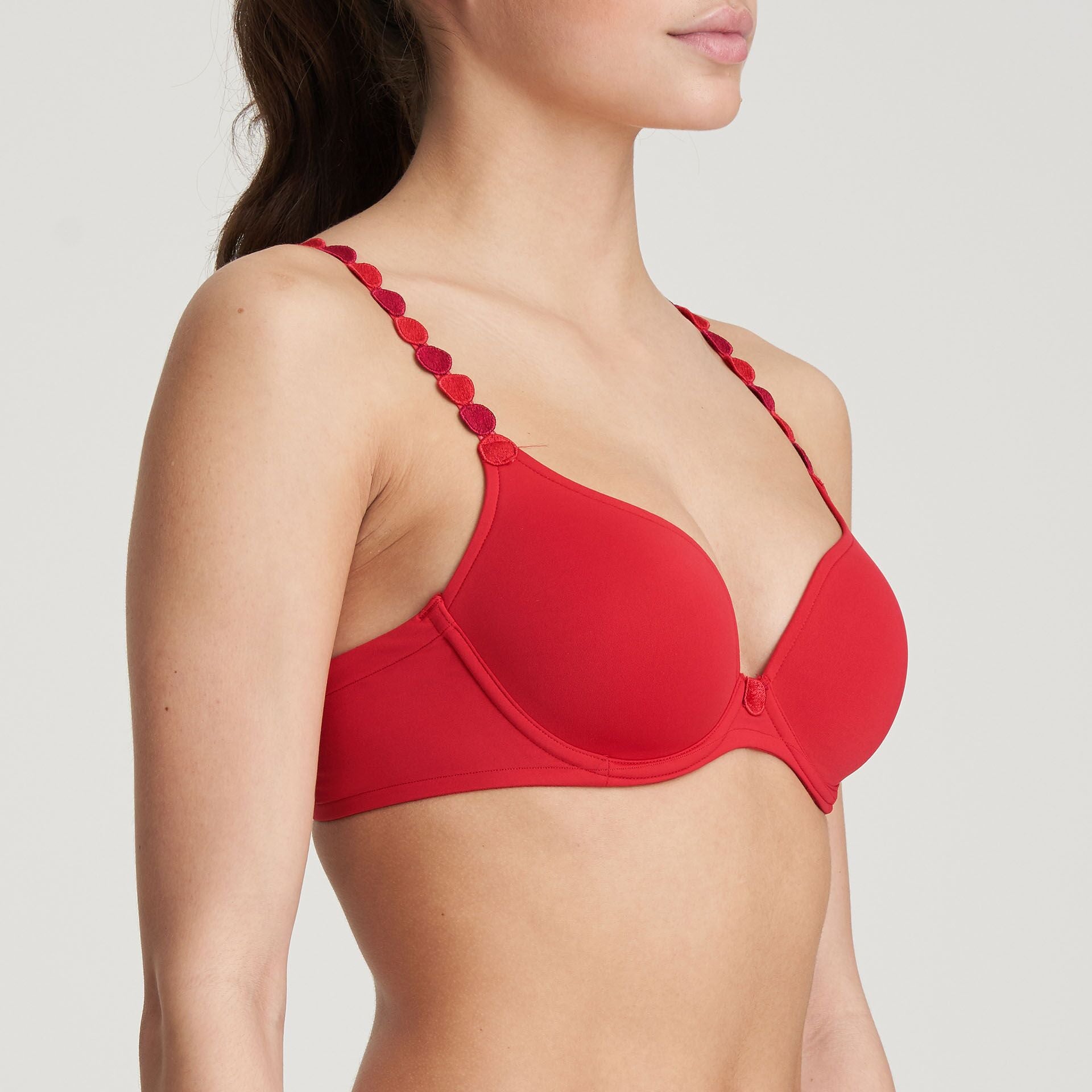 Side angle of Tom Convertible Bra in Scarlet showing deep plunge – The Foundation