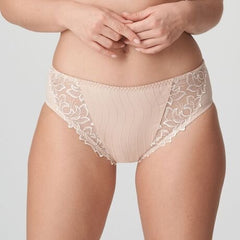 Model in PrimaDonna Deauville Full Brief in Café Latte from The Foundation, featuring high-waisted fit and decorative embroidery on the hips. front view