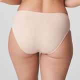 Model in PrimaDonna Deauville Full Brief in Café Latte from The Foundation, featuring high-waisted fit and decorative embroidery on the hips. back view