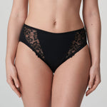 Model wearing PrimaDonna Deauville Full Brief in Black from The Foundation, with high waist fit and floral lace embroidery at the hips. front view
