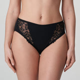Model wearing PrimaDonna Deauville Full Brief in Black from The Foundation, with high waist fit and floral lace embroidery at the hips. front view