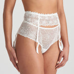 Side angle of Jane Suspender Belt in ivory, showcasing embroidered sheer panel and satin-like straps.