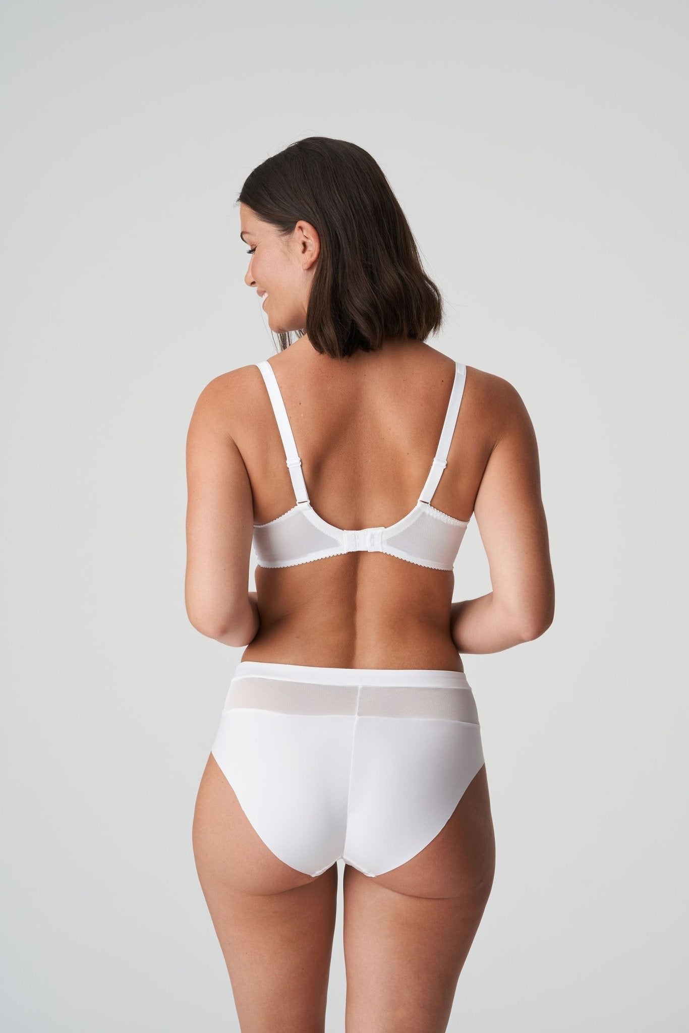 Back view of the full Sophora lingerie set in White, showing seamless design and supportive high-rise fit.