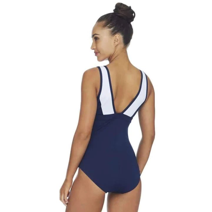 Woman wearing POOLPROOF navy mastectomy scoop rouch swimsuit from The Foundation, designed for post-surgery comfort and chlorine resistance. back view