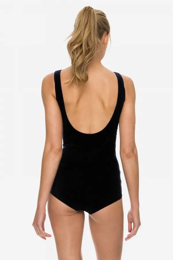 Back view of POOLPROOF swimsuit showing scoop back and full coverage cut.