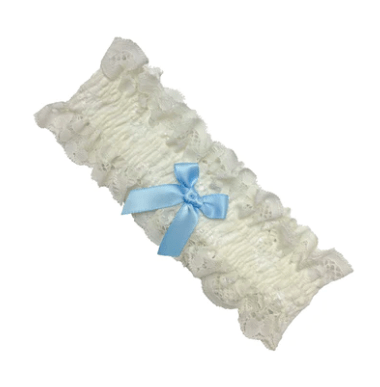 White lace bridal garter with light blue bow, available at The Foundation, elegant Italian-made accessory for a wedding day tradition.