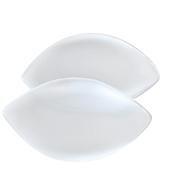 Clear silicone chicken fillet bra inserts displayed side-by-side for enhancing cleavage and lift.