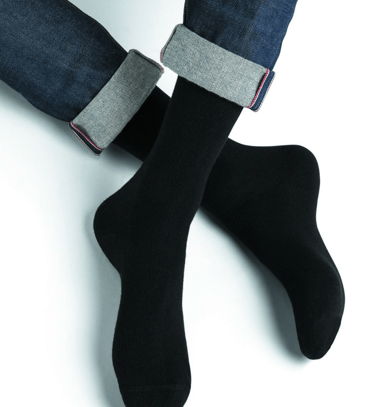 Model wearing Wool Cashmere Socks Mid Noir by Bleuforêt, available at The Foundation, showcasing soft, warm, black socks perfect for boots and winter wear.