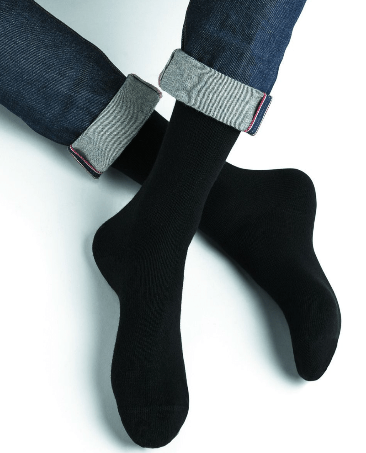 Model wearing Wool Cashmere Socks Mid Noir by Bleuforêt, available at The Foundation, showcasing soft, warm, black socks perfect for boots and winter wear.