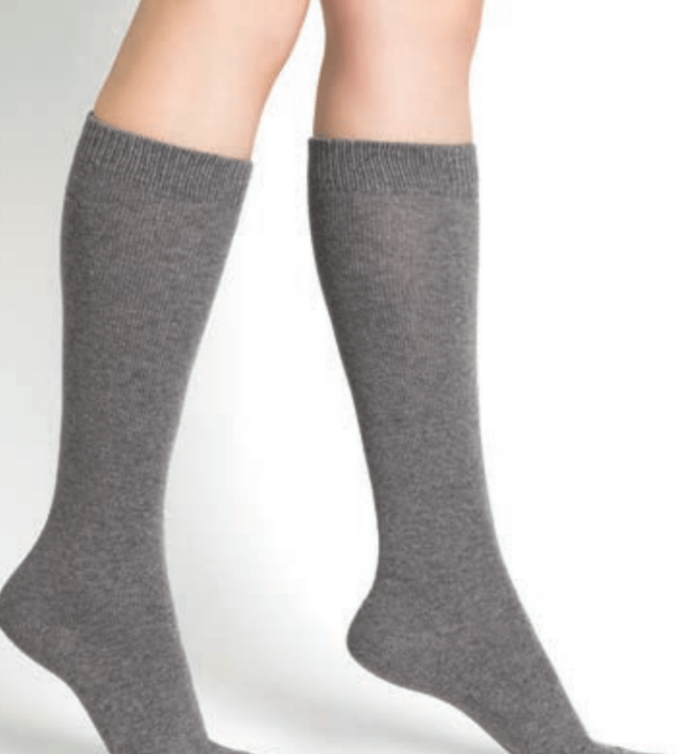 Model wearing Wool Cashmere Socks Long Gris Flanelle by Bleuforêt, available at The Foundation, featuring soft, warm, knee-high grey socks for women.