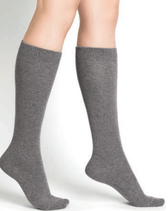 Model wearing Wool Cashmere Socks Long Gris Flanelle by Bleuforêt, available at The Foundation, featuring soft, warm, knee-high grey socks for women.