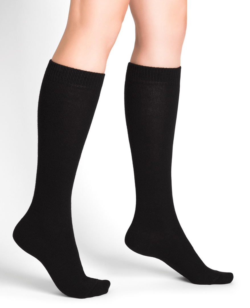 Model wearing Wool Cashmere Socks Long Noir by Bleuforêt, available at The Foundation, featuring black knee-high socks for warmth, comfort, and style.