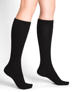 Model wearing Wool Cashmere Socks Long Noir by Bleuforêt, available at The Foundation, featuring black knee-high socks for warmth, comfort, and style.