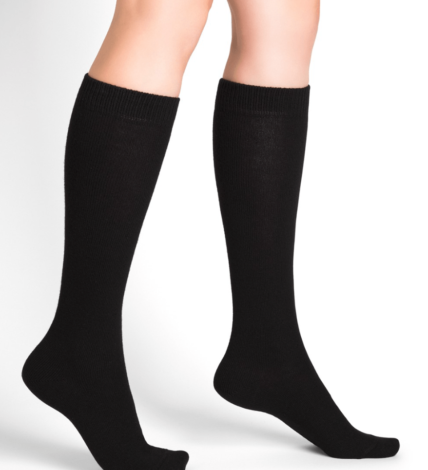 Model wearing Wool Cashmere Socks Long Noir by Bleuforêt, available at The Foundation, featuring black knee-high socks for warmth, comfort, and style.