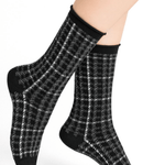 Model wearing Wool Blend Check Socks Mid Black by Bleuforêt, available at The Foundation, featuring black Prince of Wales check merino wool blend socks for women.