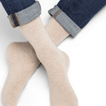 Model wearing Wool Cashmere Socks Mid Cordage by Bleuforêt, available at The Foundation, showing soft beige cashmere blend socks for warmth and comfort.