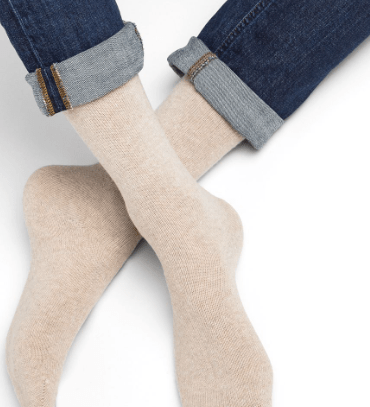 Model wearing Wool Cashmere Socks Mid Cordage by Bleuforêt, available at The Foundation, showing soft beige cashmere blend socks for warmth and comfort.