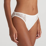 Side angle of Jane Rio Brief Natural highlighting sheer embroidery across the hips.