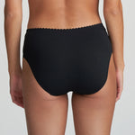 Model in Marie Jo Jane Full Brief in Black from The Foundation, featuring full coverage, sheer floral embroidery, and a front bow with pearl detail. back view