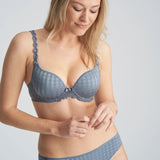 Three-quarter view of model wearing the Avero bra in Atlantic Blue, highlighting supportive plunge cups and soft sheen fabric.