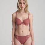 Model wearing Marie Jo Jane Padded Heart Shape Bra in Red Copper from The Foundation, featuring embroidered cups, plunge fit, and adjustable straps.