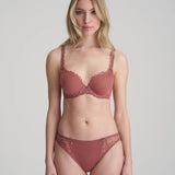 Model wearing Marie Jo Jane Padded Heart Shape Bra in Red Copper from The Foundation, featuring embroidered cups, plunge fit, and adjustable straps.