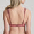 Model wearing Marie Jo Jane Padded Heart Shape Bra in Red Copper from The Foundation, featuring embroidered cups, plunge fit, and adjustable straps. back view