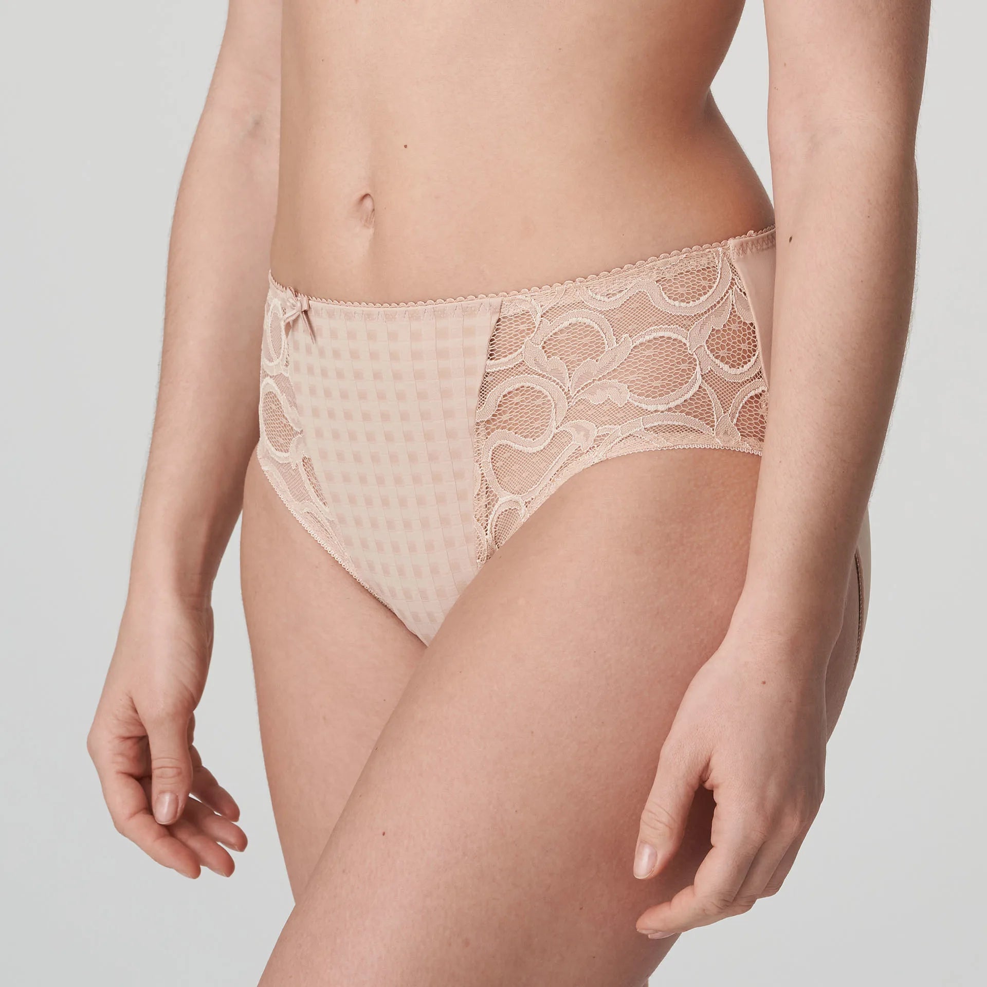 Model wearing PrimaDonna Madison Full Brief in Café Latte from The Foundation, with gingham fabric, lace sides, and high-waist full coverage. side view
