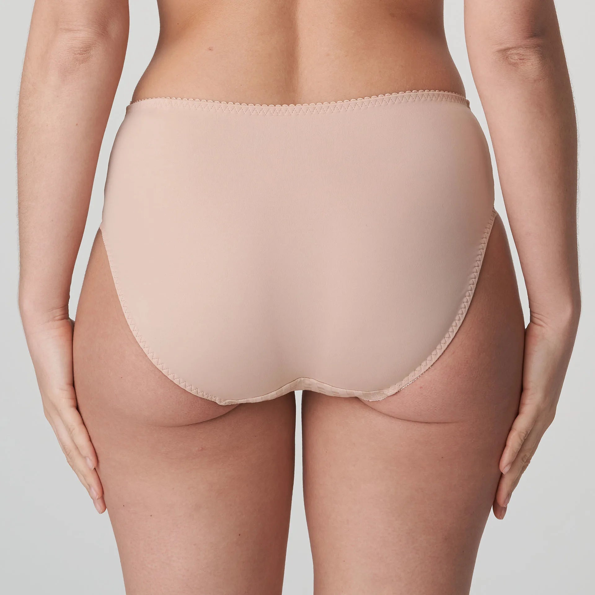 Model wearing PrimaDonna Madison Full Brief in Café Latte from The Foundation, with gingham fabric, lace sides, and high-waist full coverage. back view