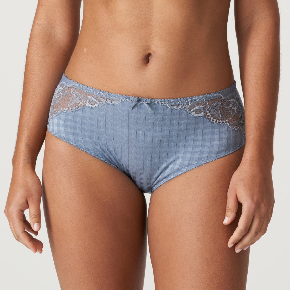 Model wearing Madison Full Brief in Atlantic Blue, showing lace that wraps from hip to back for a seamless finish.