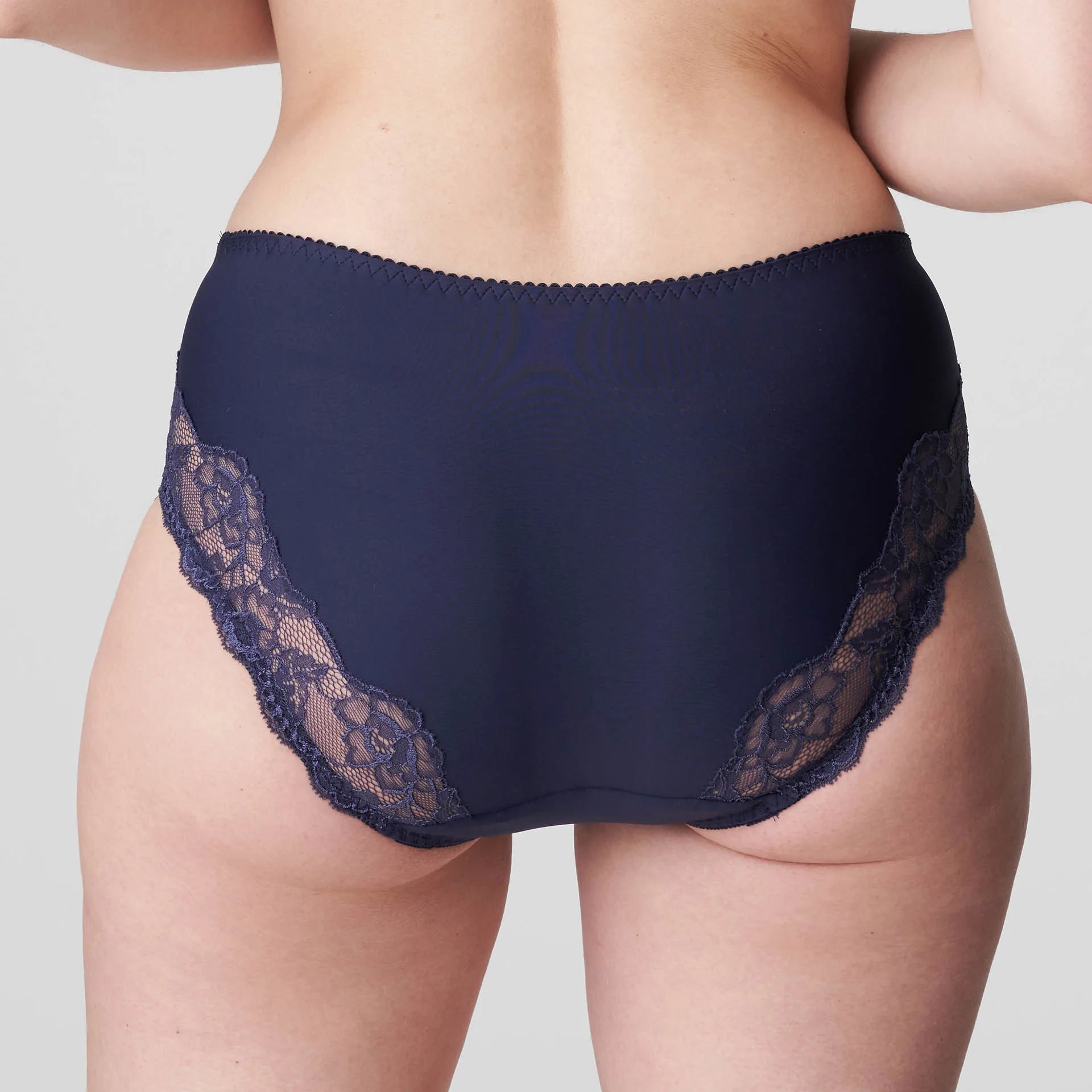 Back view of Madison Full Brief in Blue Bijou with sheer floral lace wrapping across the hips and bottom.