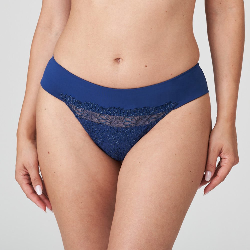 Front view of PrimaDonna Sophora Thong Royal in navy blue with sheer embroidered front, styled on model.