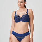 PrimaDonna Sophora Thong Royal styled with matching bra set in rich navy, featuring sheer glittering embroidery – exclusive to The Foundation.