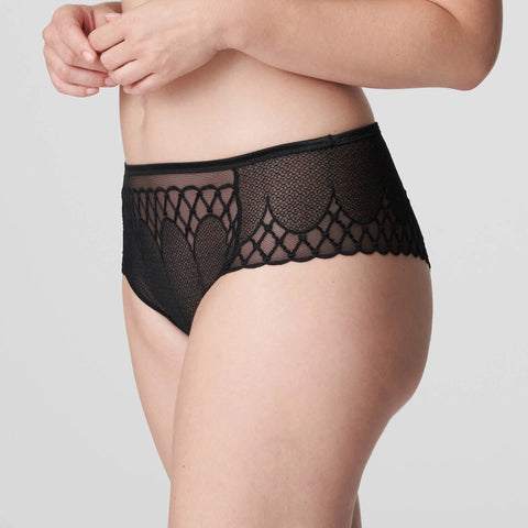 Side angle of model in PrimaDonna Vya thong, showcasing soft mesh fabric and mid-rise shape.