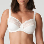 Model wearing PrimaDonna Deauville Full Cup Bra in Natural from The Foundation, featuring deep supportive cups and elegant embroidered detailing. close up