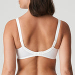 Model wearing PrimaDonna Deauville Full Cup Bra in Natural from The Foundation, featuring deep supportive cups and elegant embroidered detailing. back view