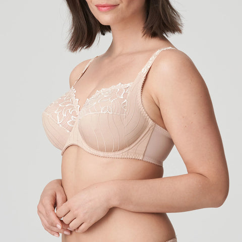 Model wearing PrimaDonna Deauville Full Cup Bra in Café Latte from The Foundation, with embroidered cups, side support, and a flattering fit. side view