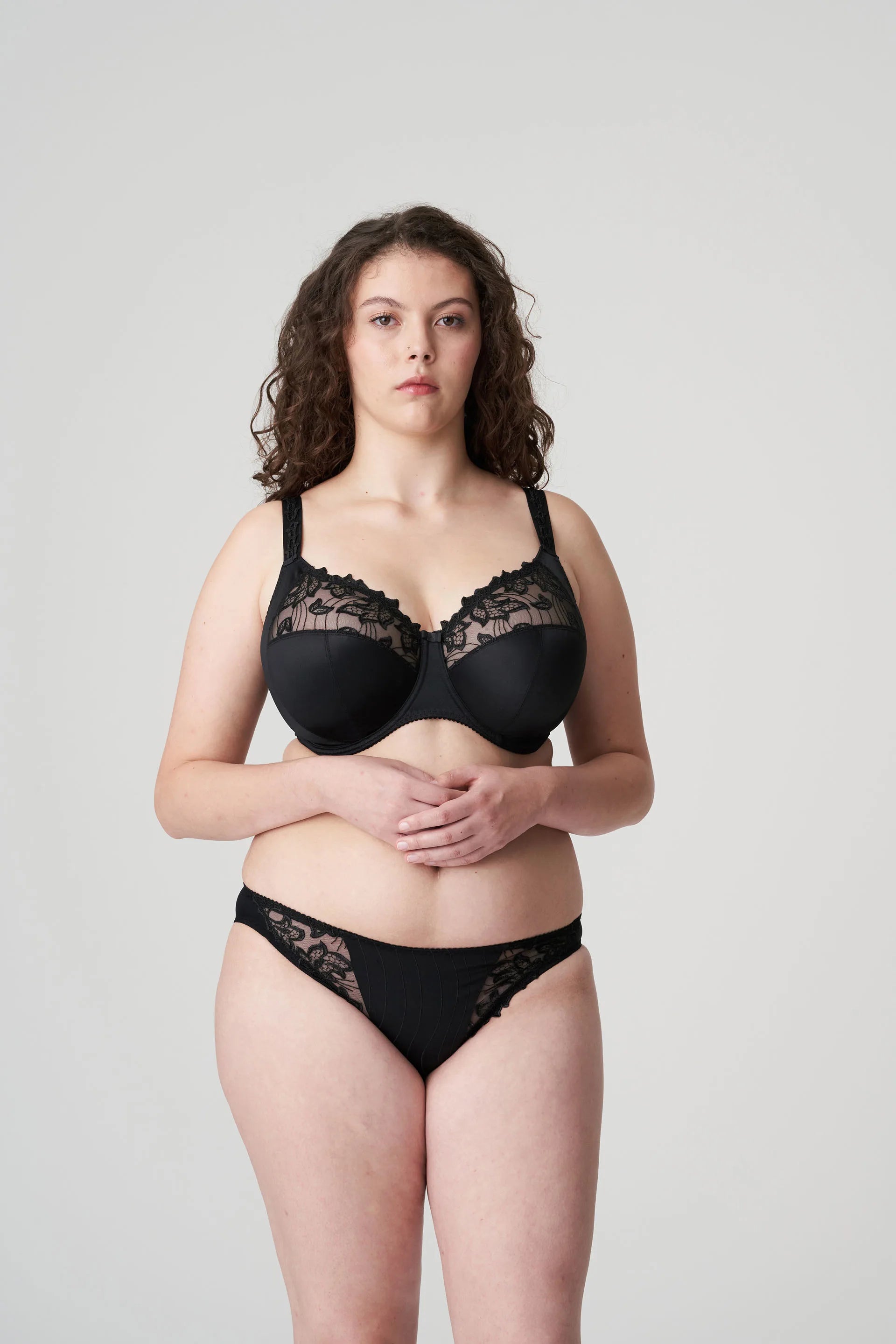 Full body image of model wearing the Deauville Full Cup Bra Black and matching briefs from The Foundation.