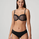 Model wearing PrimaDonna Twist I Want You bra and brief set in Black, styled with lace, sheer mesh and bold hardware.