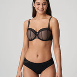 Model wearing PrimaDonna Twist I Want You bra and brief set in Black, styled with lace, sheer mesh and bold hardware.