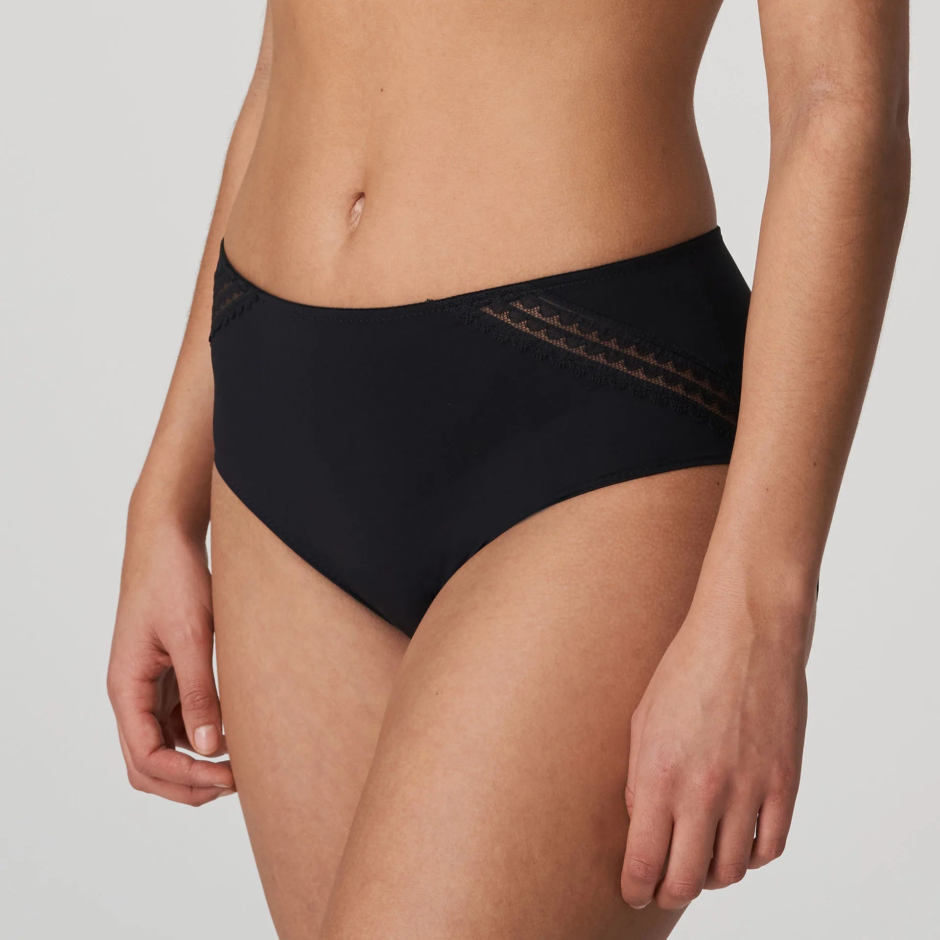 Side angle of PrimaDonna Twist I Want You Full Brief in Black, shown on model with lace side detailing and smooth high-waist front.