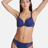 Model wearing Marie Jo Jane Padded Heart Shape Bra in Lazurite Blue from The Foundation, with embroidered cups, plunge neckline, and convertible straps. front view