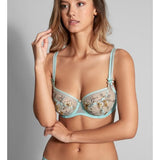 Model wearing Lauren Underwire Low Necked Bra in Turquoise, styled with embroidered detail – available at The Foundation.