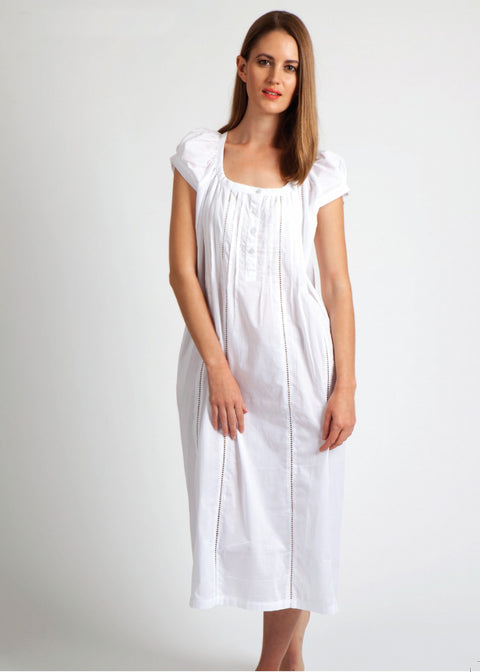 Model wearing Cap Sleeve Cotton Front Button Nightie in white, featuring pintuck detailing, ladder lace hem, and a button-down front.