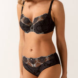 Model wearing Empreinte Lilly Rose bra and brief in black, styled as a matching romantic lingerie set.