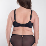 Back view of model wearing Perla Midi Brief Black – showcasing invisible mesh design – The Foundation