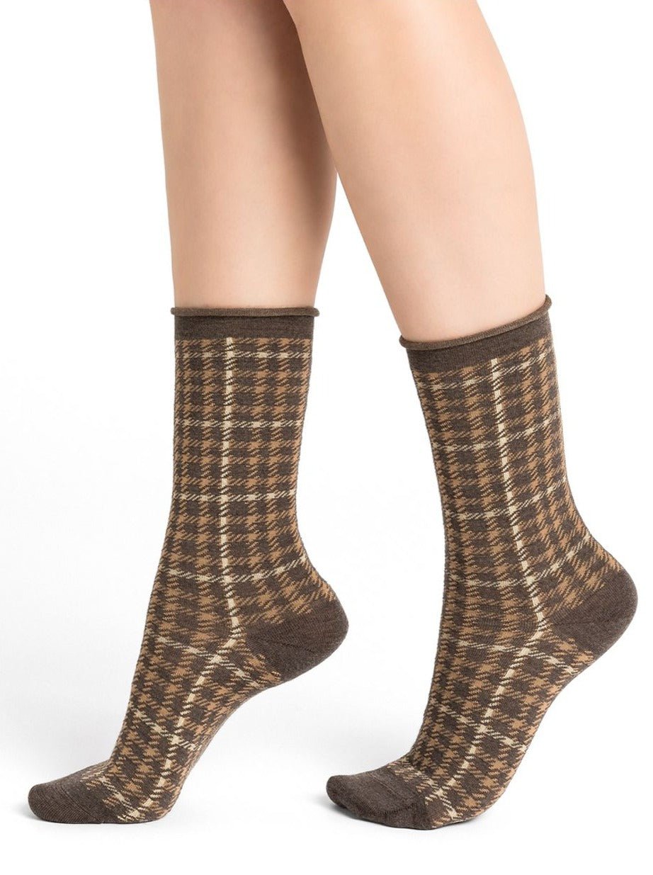 Model wearing Wool Blend Check Socks Mid Marmot by Bleuforêt, available at The Foundation, showing brown check patterned merino wool blend socks for women.