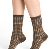 Model wearing Wool Blend Check Socks Mid Marmot by Bleuforêt, available at The Foundation, showing brown check patterned merino wool blend socks for women.